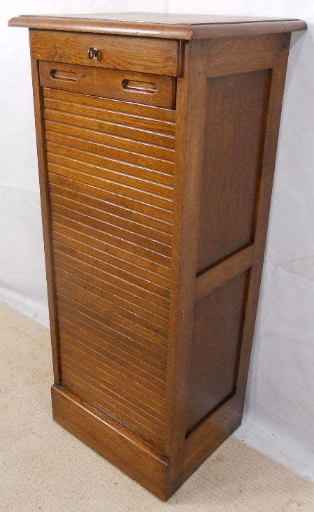 Crafted from steel, it includes two file drawers with a letter filing system that is hanging file compatible. Oak Roll Front Filing Cabinet | 190477 | Sellingantiques.co.uk
