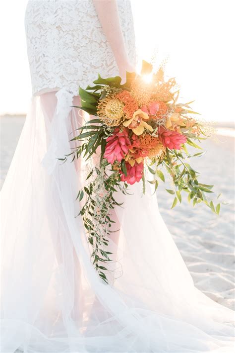 Wedding arch decorated with flowers on tropical sand beach, outd. Tropical Beach Wedding Ideas from Germany