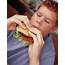 Eating A Burger  Stock Image P920/0241 Science Photo Library