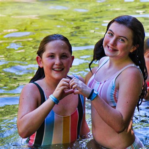 Girls Swimming In A Lake