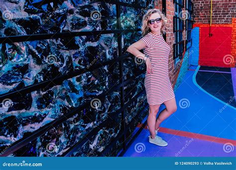 Young Beautiful Girl Posing On The Sport Playground In Bright Sports