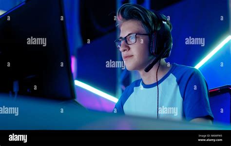 Teenage Boy Gamer Plays In Competitive Video Game On A Esports