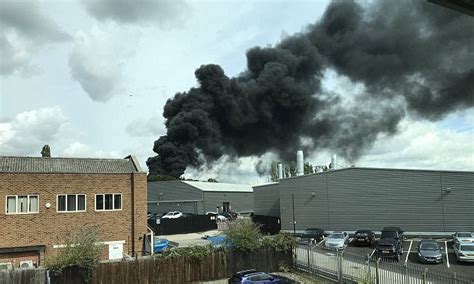 Huge Plume Of Black Smoke Is Seen Billowing Into The Sky After Blaze