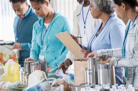Through donated food, united states department of agriculture (usda) commodities and purchased food, and the generous support. Food Bank Manager Helps Food Bank Volunteers Stock Photo ...