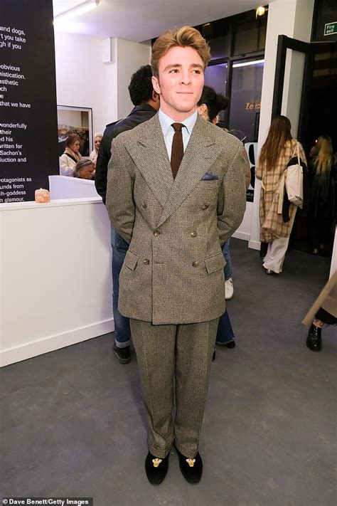 Rocco Ritchie Cuts A Dapper Figure In A Tweed Suit At Exhibition