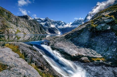 Mountains And River Landscape In Fiordland National Park New Zealand