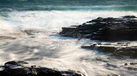 Splashing Stormy Windy Sea Waves On A Rocky Seashore Stock Image
