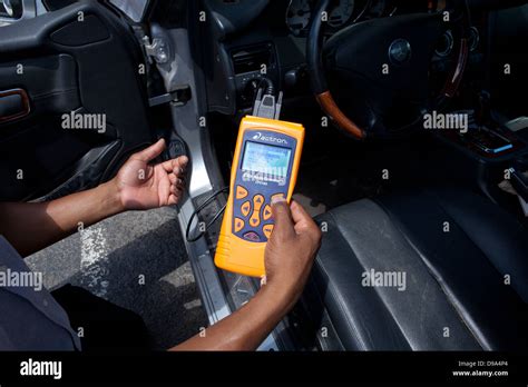 Auto Mechanic Using Car Diagnostic Scanner Obd Ii Scanner Usa Stock
