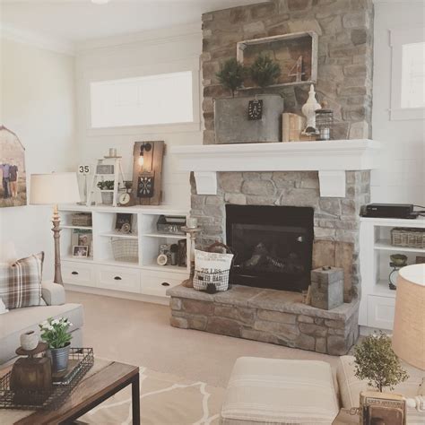 Fotos im projekt modern farmhouse with stone exterior. White plank walls surround this stone fireplace for a ...
