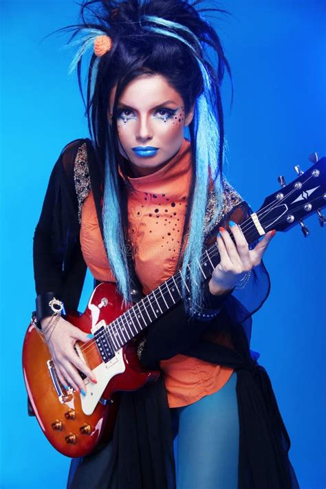 Rock Girl Posing With Electric Guitar Playing Hard Rock Stock Photo