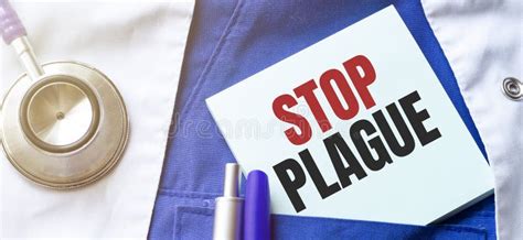 Stethoscope Pens And Note With Text Stop Plague On The Doctor Uniform Stock Image Image Of