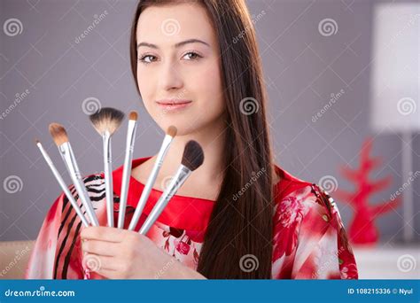 Young Woman Holding Make Up Brushes Stock Photo Image Of Facial