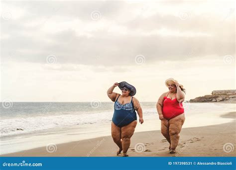 Happy Plus Size Women Having Fun Walking On The Beach Stock Image Image Of Happy Chubby