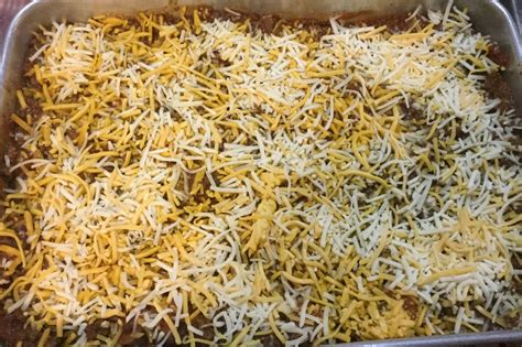 Sprinkle the tater tots with shredded cheddar cheese. Countrified Hicks: Cheesy Chili Dog Tater Tot Casserole