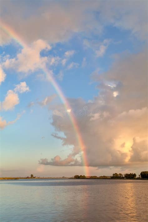 Rainbow Over Lake At Sunset Stock Photo Image Of Beauty Reflection