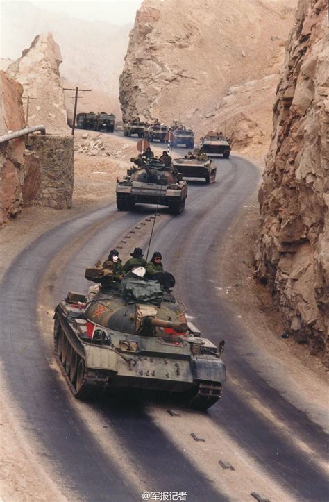 Type 59 Tanks Leading Motorized Convoy During Exercise In Western China