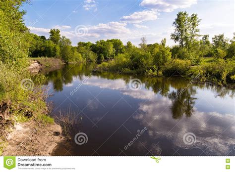 Spring River Landscape On Background Of Green Trees And Clouds Stock