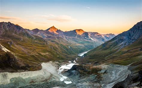 Daybreak In The Swiss Alps View Of The Valley And Glacial Moraines