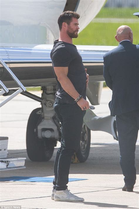 Thor S Chris Hemsworth Performs Stretches After Stepping Off A Plane In Melbourne Daily Mail