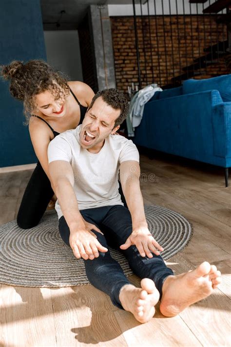 Fit Young Man Doing Sport Exercise At Home With Laptop Lying On Floor