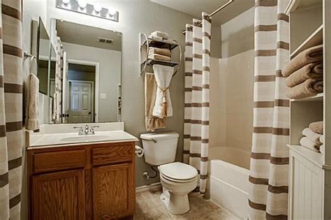 Decorations can easily become clutter in such a limited space. Brown and White/Cream Bathroom Decor | bathroom ideas ...