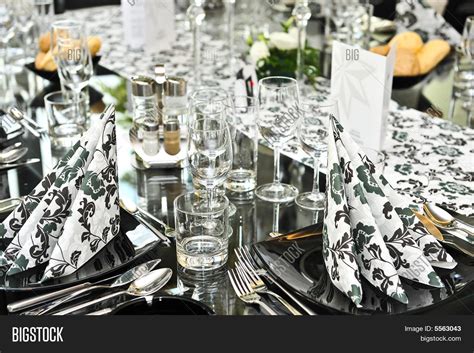 This dining table enhances the look of your dining room with its glam base and expansive surface. Fancy Dinner Table Set Image & Photo (Free Trial) | Bigstock