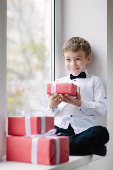 Happy Little Boy Wearing White Shirt And Bow Tie Near Window Hol Stock