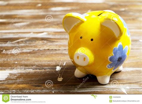 Savings Concept Piggy Bank And Money On Dark Wood Background Stock