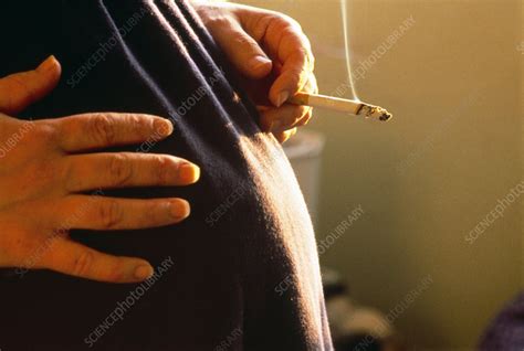 Pregnant Woman Smoking A Cigarette Stock Image M805 0149 Science Photo Library