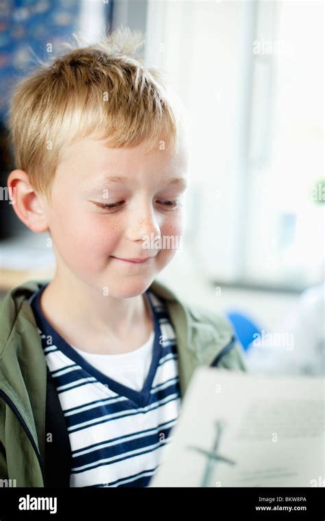Boy Reading Tetbook Stock Photo Alamy
