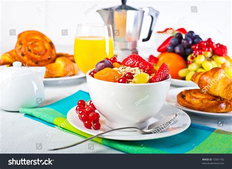 Setting with either a juice or beverage glass. Table Set Up For Continental Breakfast: Muesli, Fruits And ...