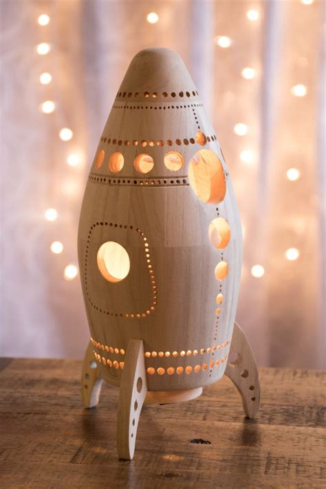 These night lights have a lot of lasting power, working for a long time before needing a replacement bulb and they provide more ambient light by plugging into the wall. Rocket Night Light - Wooden Bedside Lamp - Space Themed ...