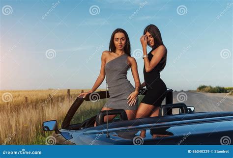 Beautiful Two Women Sitting In A Convertible Stock Image Image Of Beauty Road 86340229