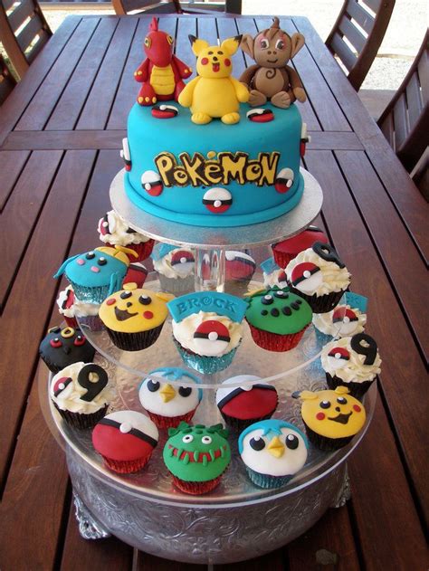 There Is A Cake With Many Cupcakes On It And An Angry Birds Theme