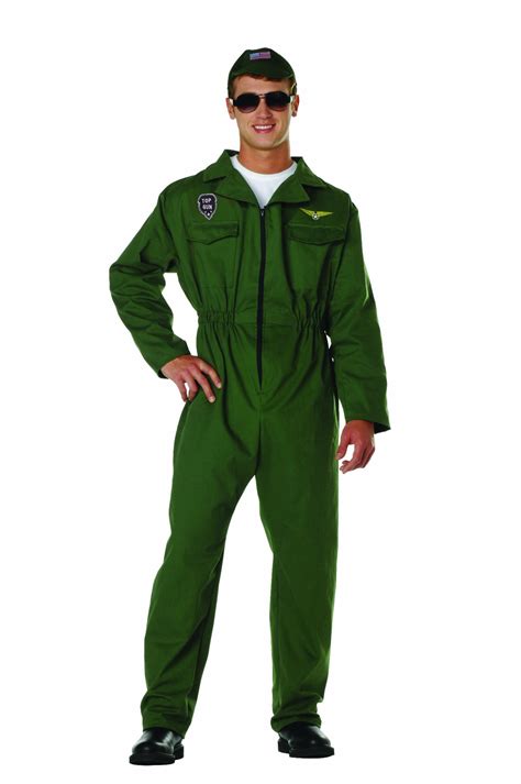 A Man In A Green Flight Suit Is Standing With His Hands On His Hips And