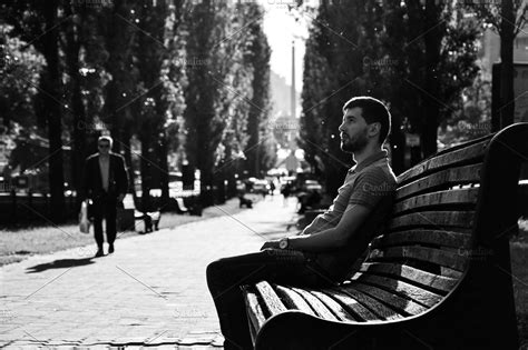 Young Sad Man Sitting On The Bench High Quality People Images