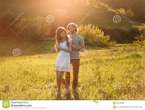 Stylish Young Couple Film Photo At Sunset And With A Sunlight A Blond