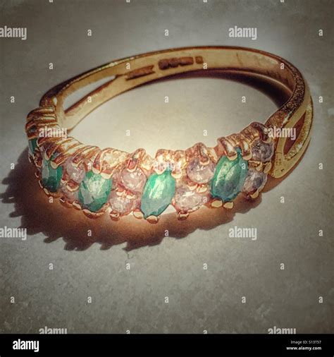 Antique Gold Ring Set With Emeralds And Diamonds Stock Photo Alamy