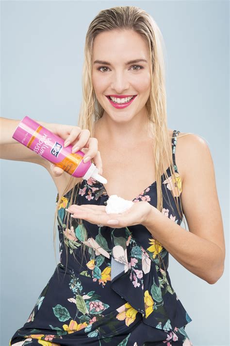 What Is Hair Mousse Guide Shot Of Model Squirting Hair Mousse Into Her