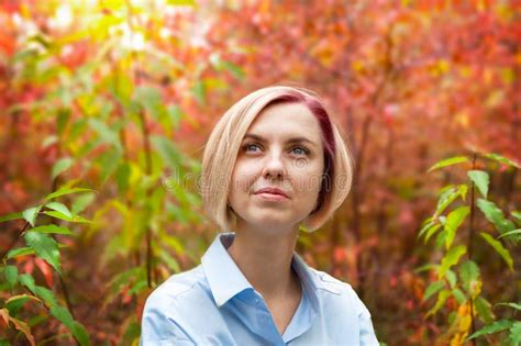 Portrait Of A Pensive Beautiful Middle Aged Blonde Woman In An Autumn