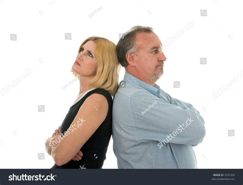 Man And Woman Standing Back To Back In An Argument Stock
