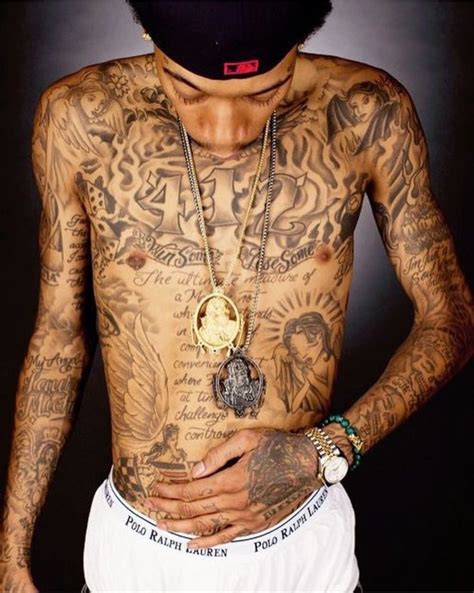Rapper wiz khalifa has tattoos all over his body, as well as on the side of his face, too. Wiz khailfa tattoos | Wiz khalifa tattoos