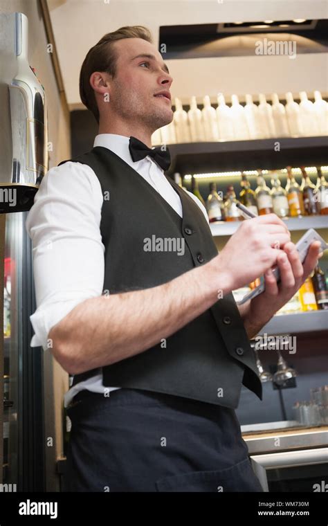 Waiter Taking Order In His Notepad In A Bar Stock Photo Alamy