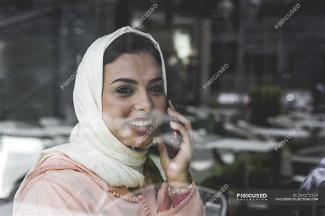Moroccan Woman With Hijab And Traditional Arabic Dress Talking On Phone