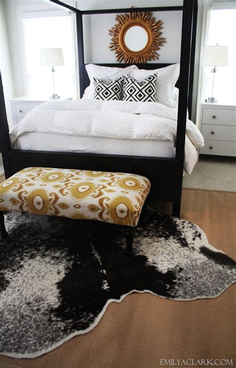 Beautiful!aprili love my cowhide rug. Cowhides Layered Over Natural Fiber Rugs | Driven by Decor