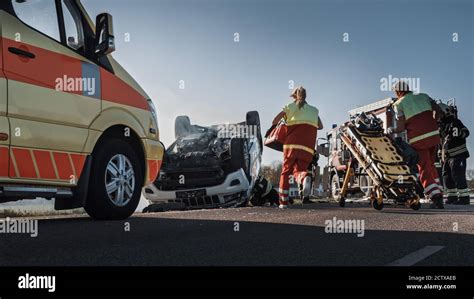 On The Car Crash Traffic Accident Scene Team Of Paramedics And