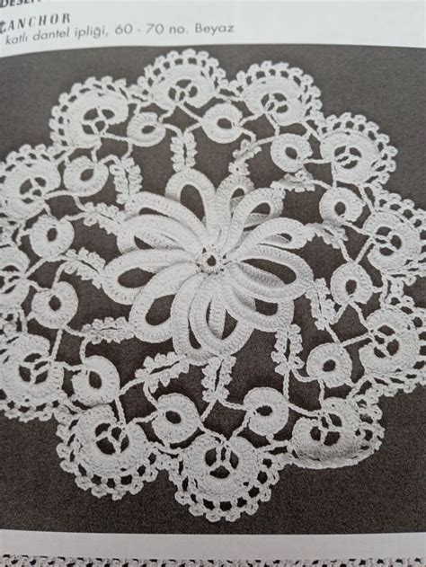 An Intricate Lace Doily Is Featured In This Book