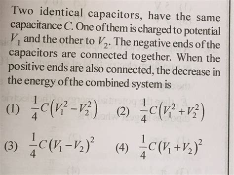 Two Identical Capacitors Have The Same Capacitance C One Of Them Is