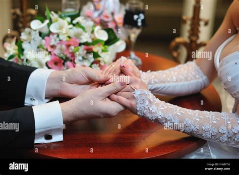 Groom Holds His Brides Hand Stock Photo Alamy