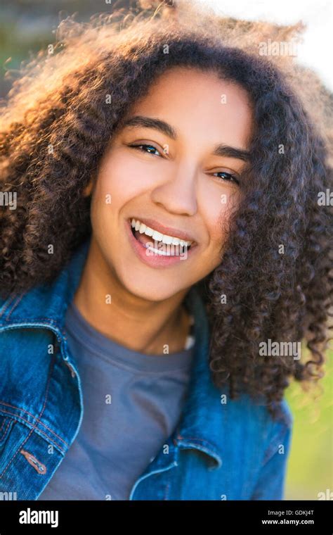 Outdoor Portrait Of Beautiful Happy Mixed Race African American Girl Teenager Female Young Woman